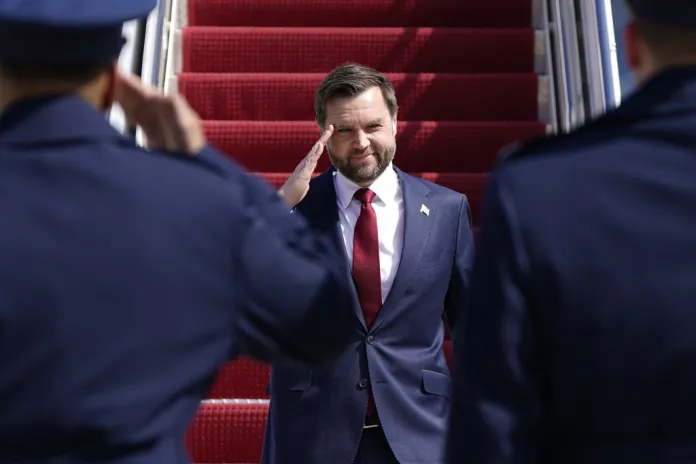 Vice President JD Vance salutes as he walks off Air Force Two, Wednesday, March 18, 2026 at Joint Base Andrews, Md., returning from a day trip to Waterford Township, Mich. (Elizabeth Frantz/The New York Times via AP, Pool)
