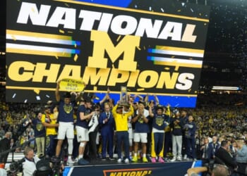 Michigan muscles its way to program’s 2nd national title, beating stubborn UConn 69-63