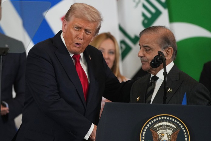 President Donald Trump shakes hands with Pakistan Prime Minister Shehbaz Sharif.
